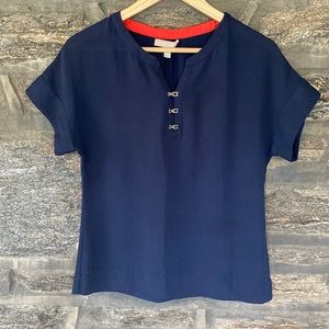 Navy blue top with metal clasps